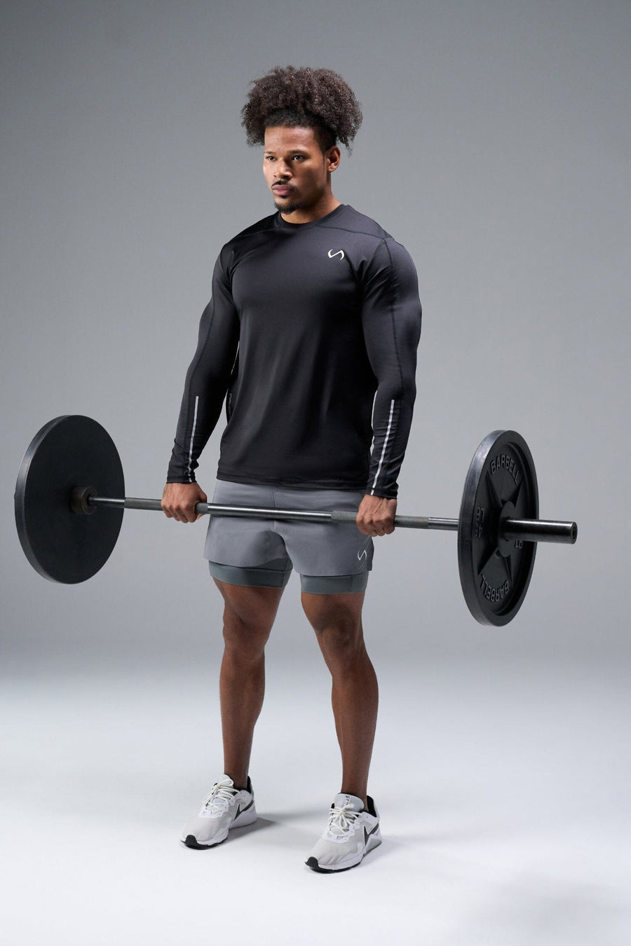 Front View of Black TLF Train Infi-Dry Long Sleeve, featuring our Infi-Dry fabric technology and reflective sleeve design for night running 