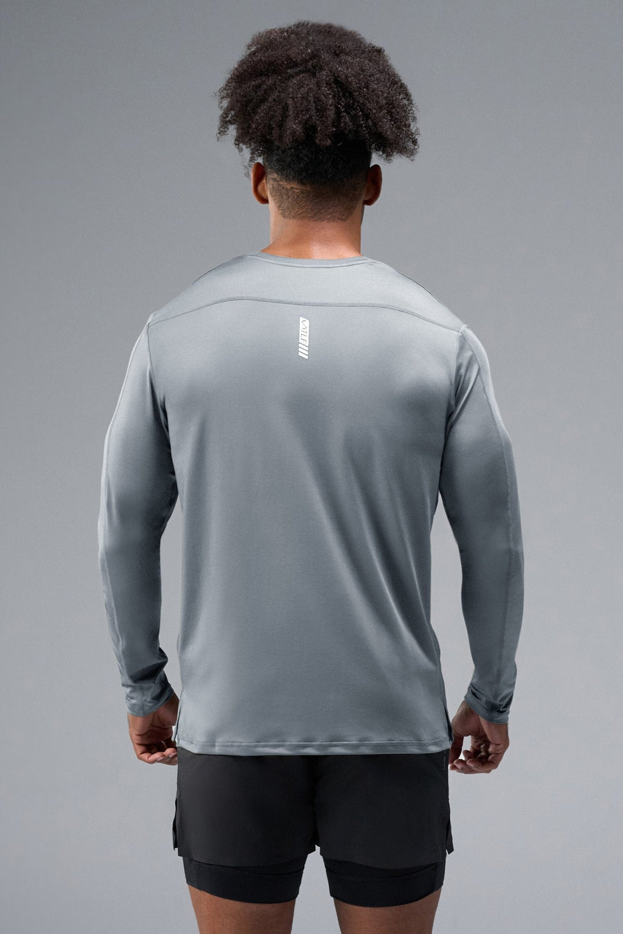 Back View of Gray TLF Train Infi-Dry Long Sleeve, featuring our Infi-Dry fabric technology and reflective sleeve design for night running 
