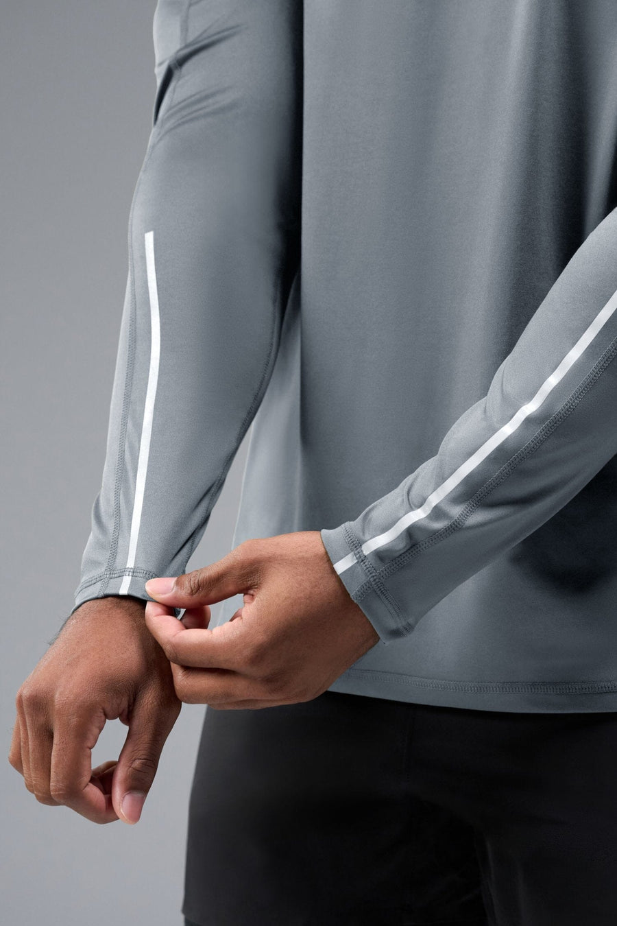 Front View of Gray TLF Train Infi-Dry Long Sleeve, featuring our Infi-Dry fabric technology and reflective sleeve design for night running 