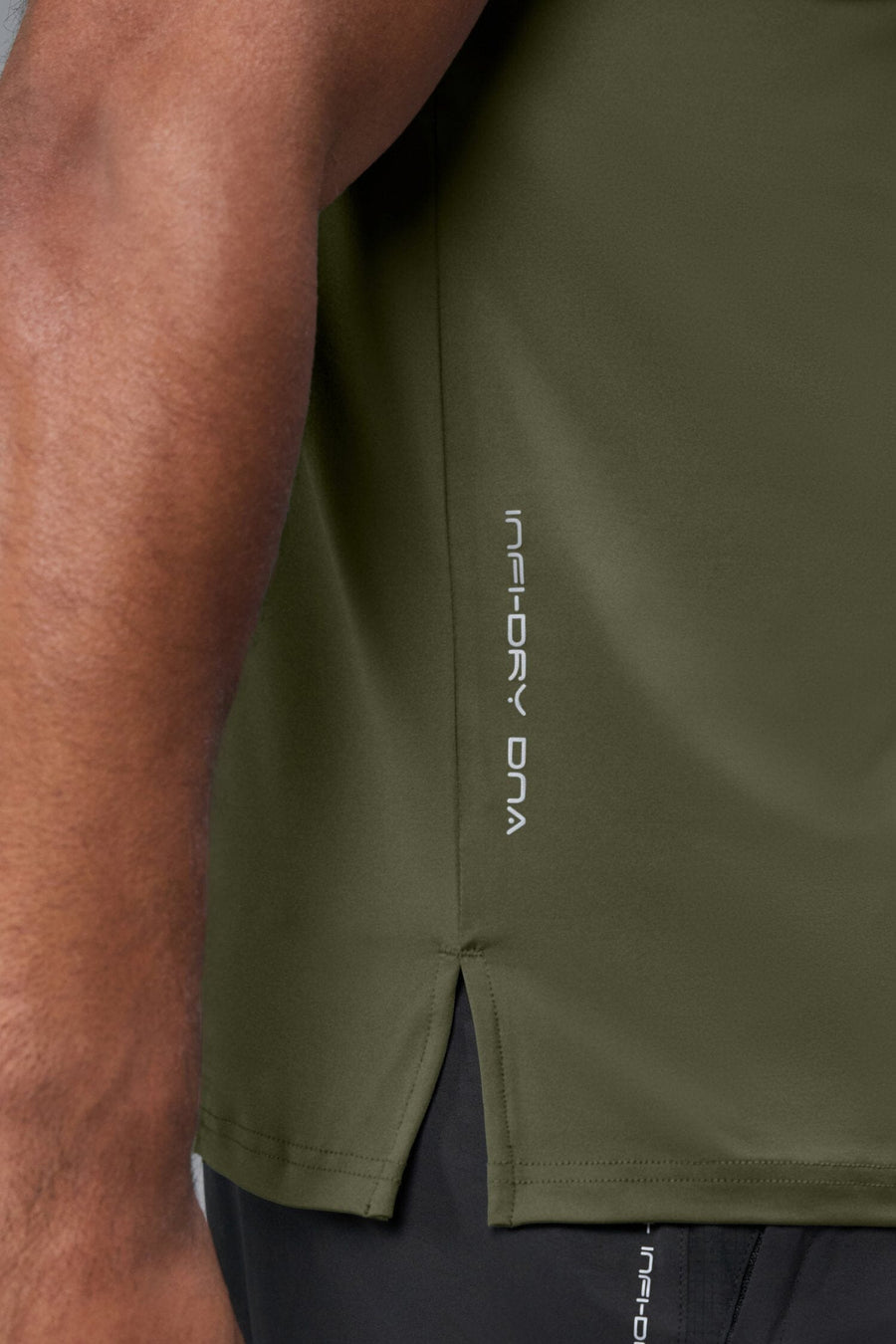 Side View of Green TLF Infi-Dry Swole Tee, crafted with our custom swole fit and utilizing our infi-dry fabric technology